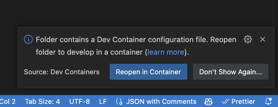 VS Code UI showing a prompt to reopen in dev container